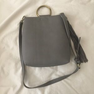 Gray Anthropologie purse with removable tassel